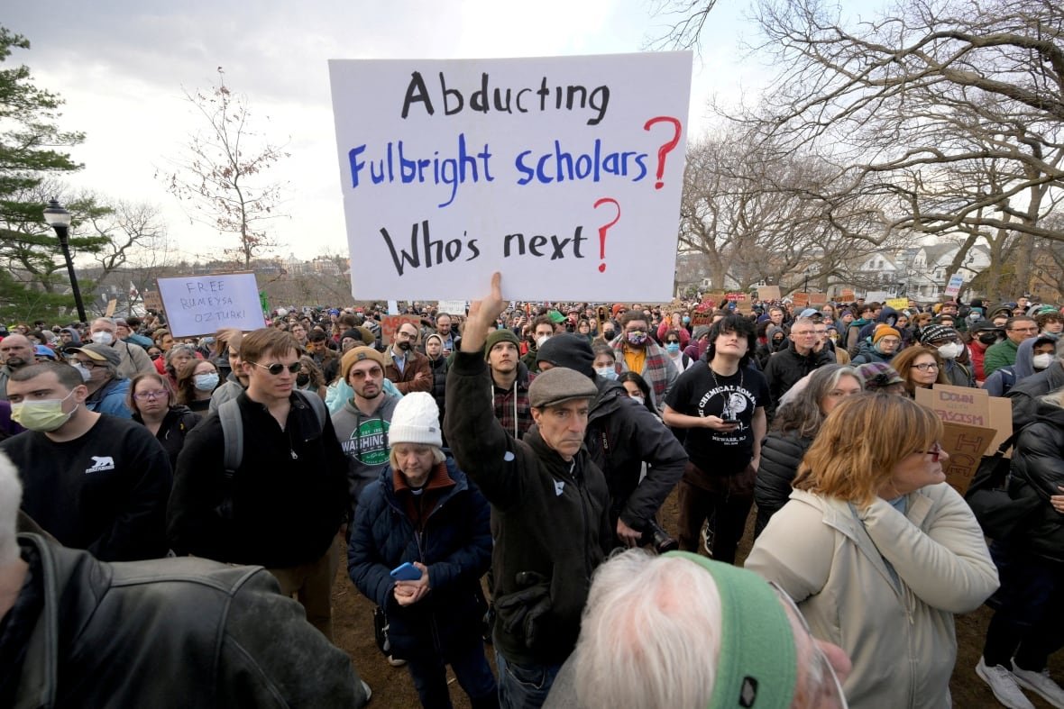 usa-trump-tufts-1 People take part in a rally.