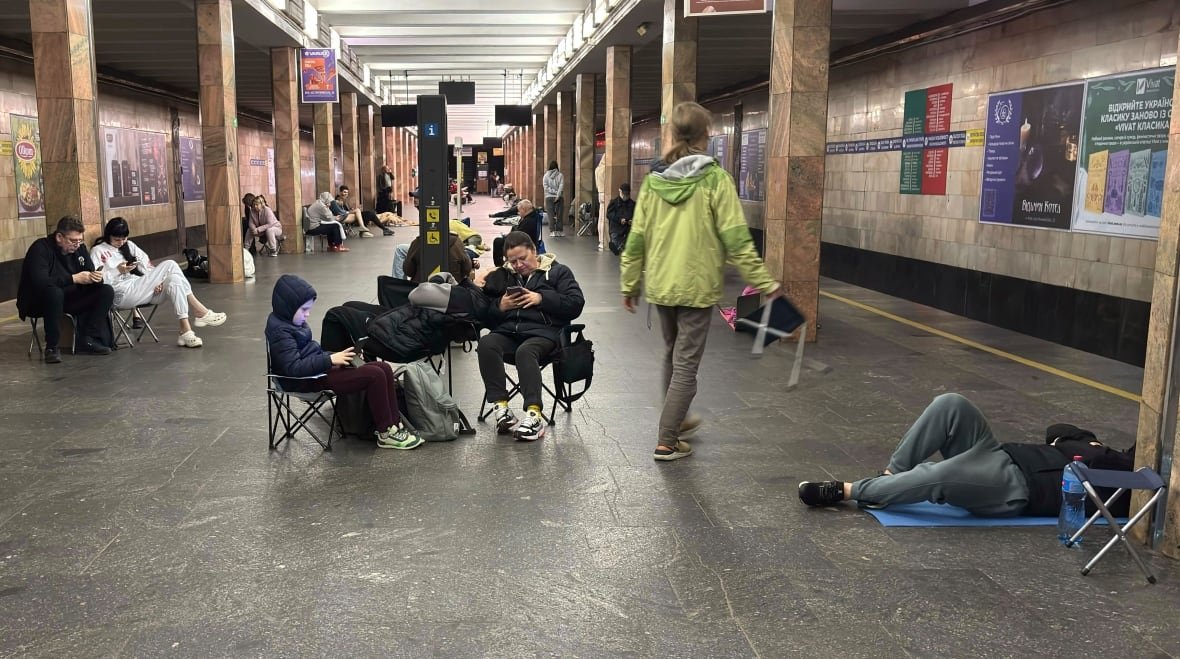 People shelter inside a Kyiv subway station, amid a Russian drone-and-missile attack.