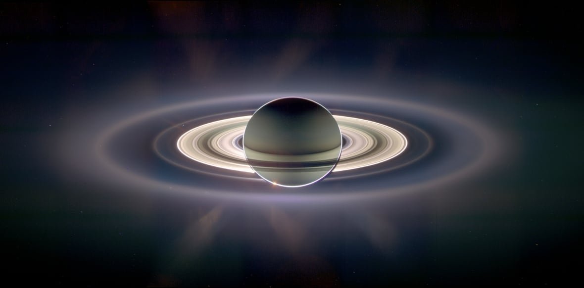 saturn-rings-solstice Rings surround a planet hanging in space.