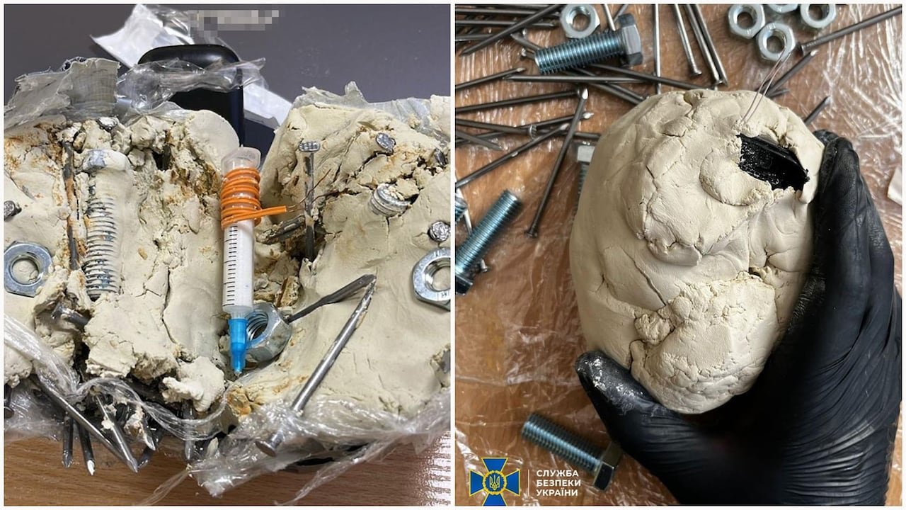 A homemade bomb containing a syringe, nuts, and bolts encased in a beige substance.