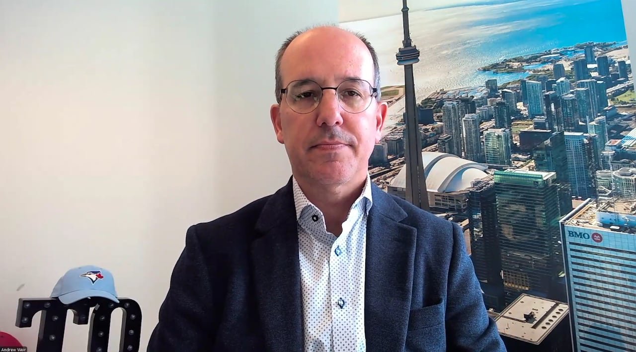 default-539 Weir is pictured in front of a poster of Toronto's skyline