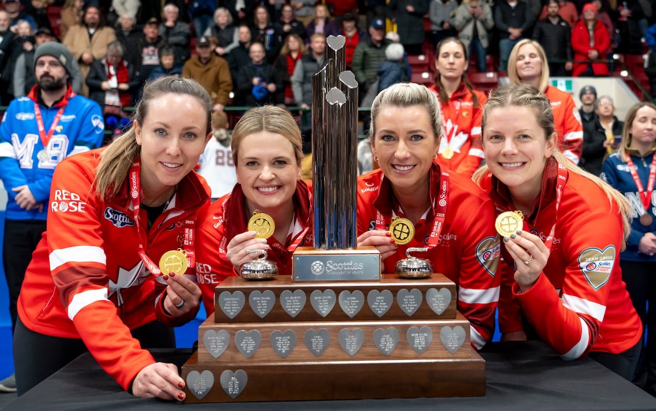 Rachel Homan, Tracy Fleury, Emma Miskew, and Sarah Wilkes celebrate after defeating Team Manitoba in the finals during the Scotties Tournament of Hearts action in Thunder Bay, Ont., Sunday, Feb. 23, 2025. THE CANADIAN PRESS/David Jackson