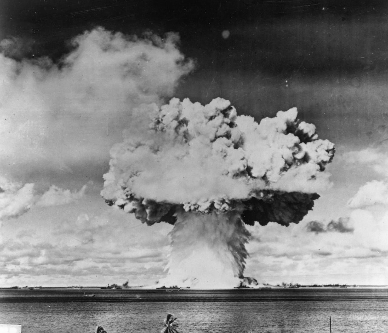 default-832 A black and white photo of a mushroom cloud over the ocean