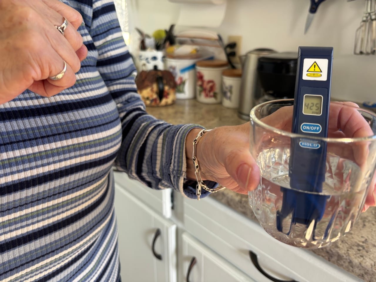 default-425 A Slemon Park resident tests the tap water in her home for PFAS.
