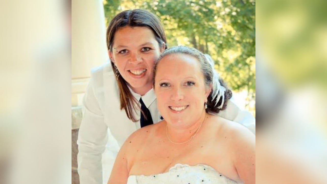 default-1085 Two women in wedding attire smile.