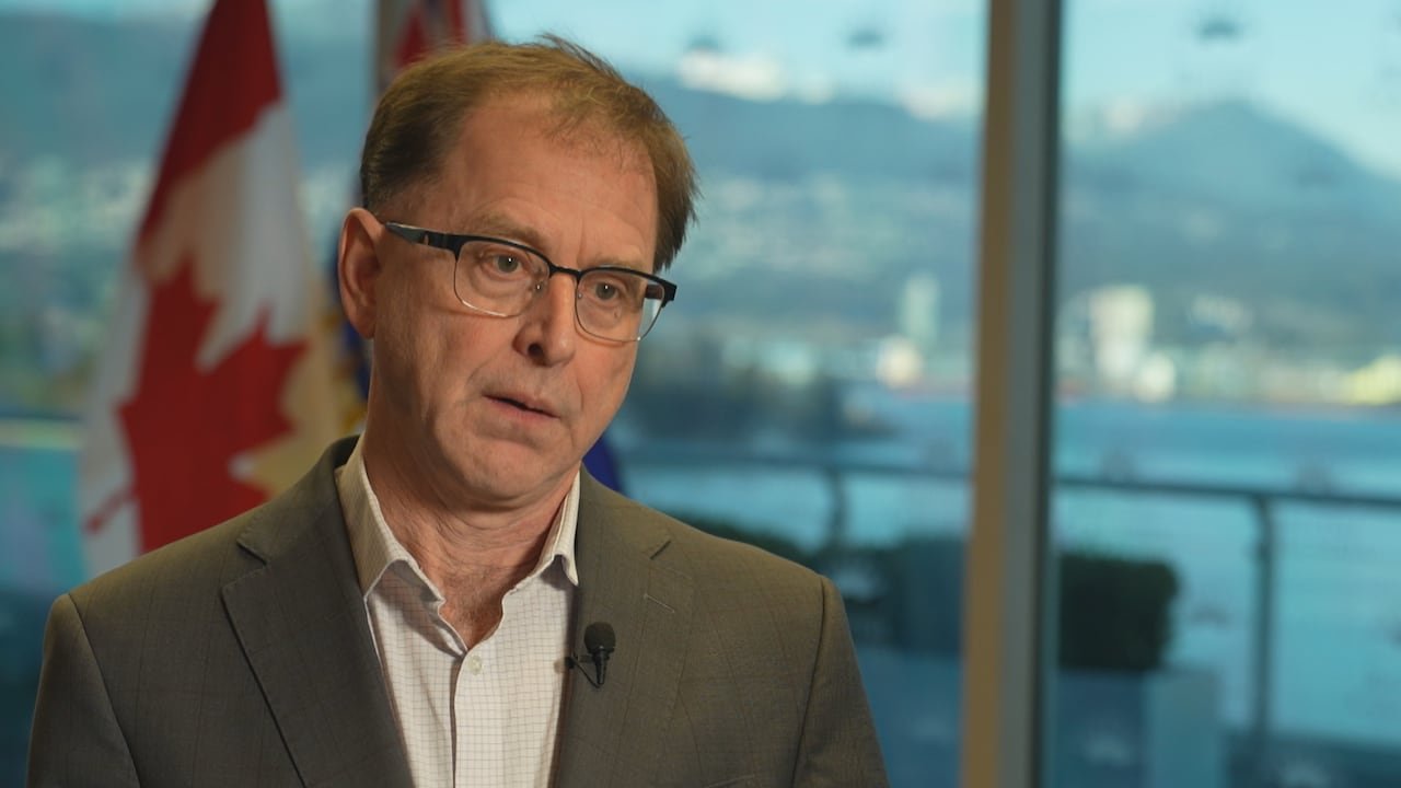 A man in a suit during an interview.