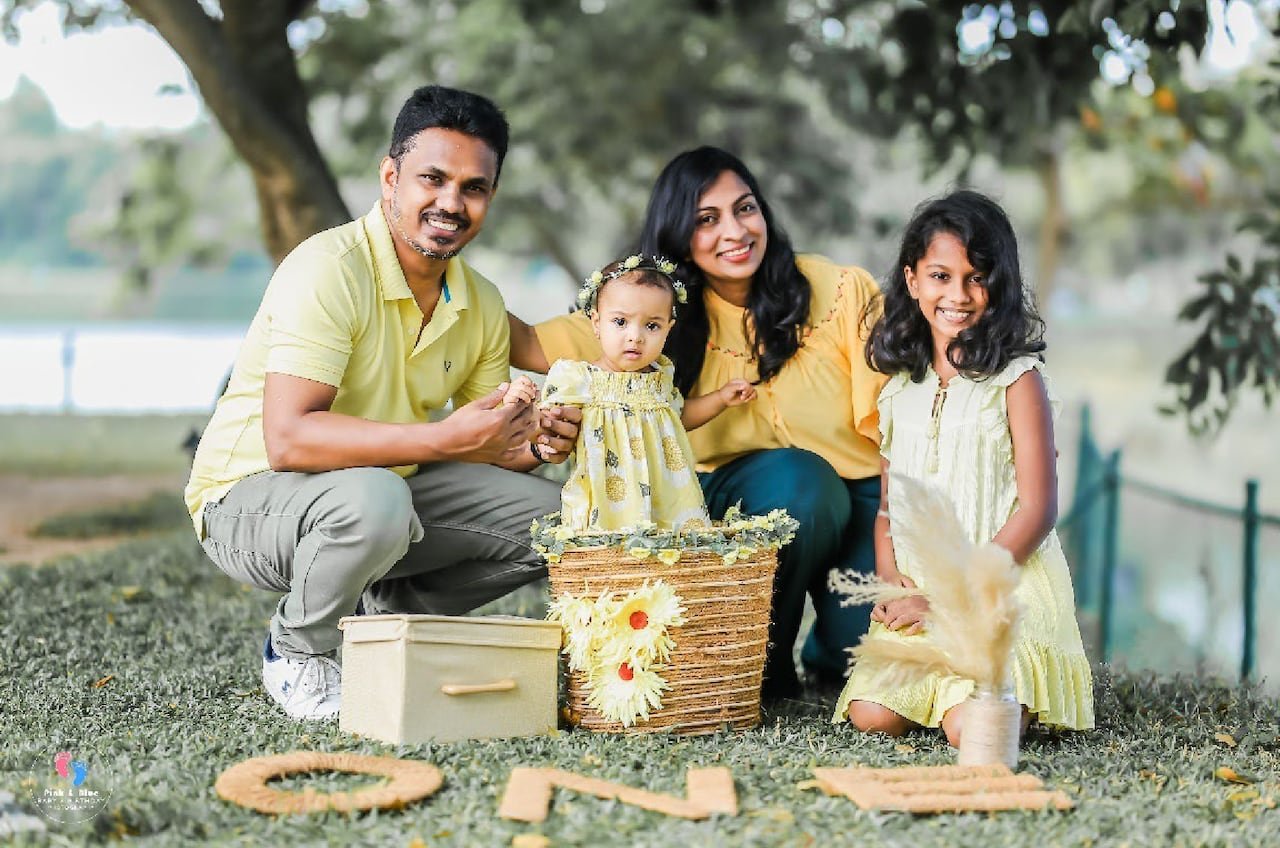 Gamini Amarakoon, left, who boarded with the Wickramasinghes and was also murdered in the attack, is pictured here with his own family back in Sri Lanka.